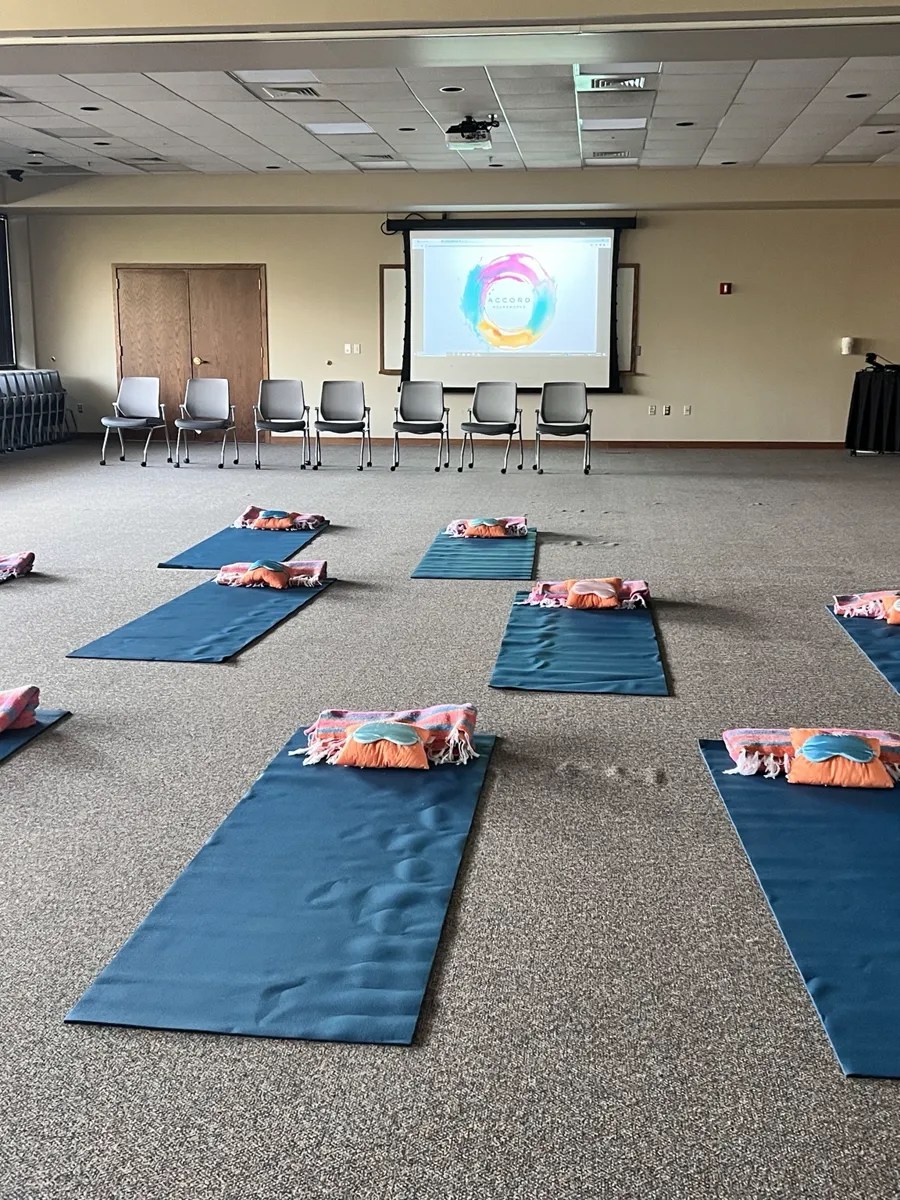 Mats and chairs arranged to offer two ways to participate in a group sound bath